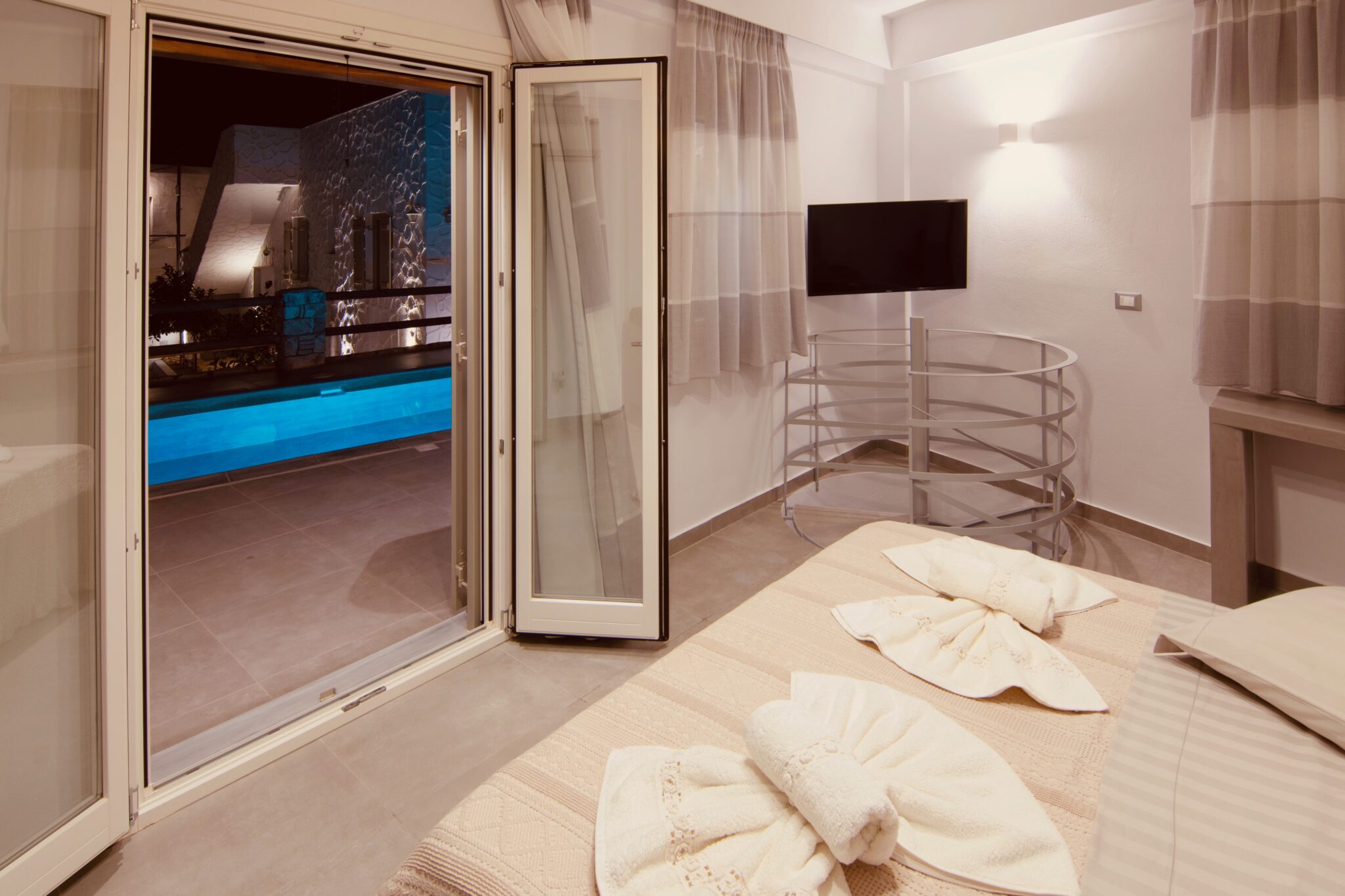 Suite with Private Pool – bedroom opening onto the pool terrace
