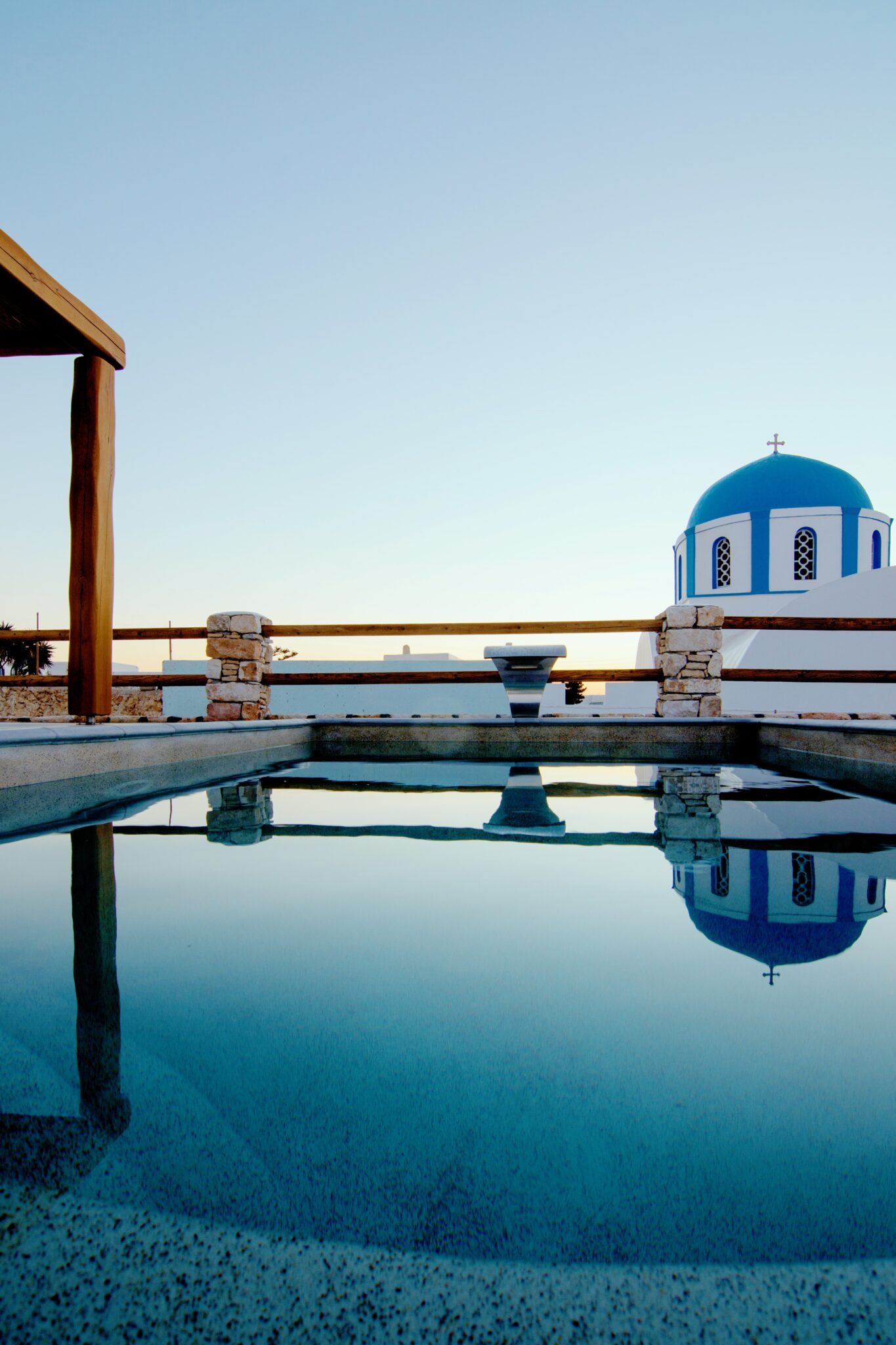 Suite with Private Pool at dusk – pool, pergola and the church dome of Chora